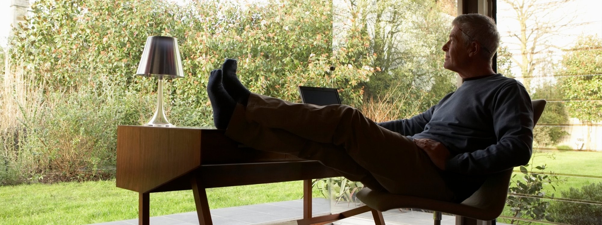 Relaxed business man at desk.