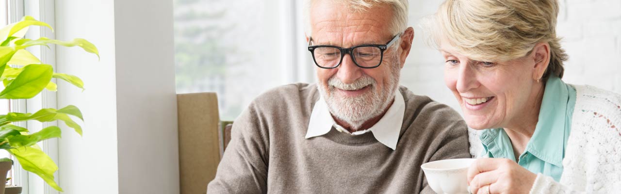 Elderly Australian couple looking at retirement planning.