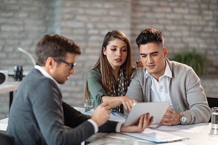 Couple meeting a financial planner.