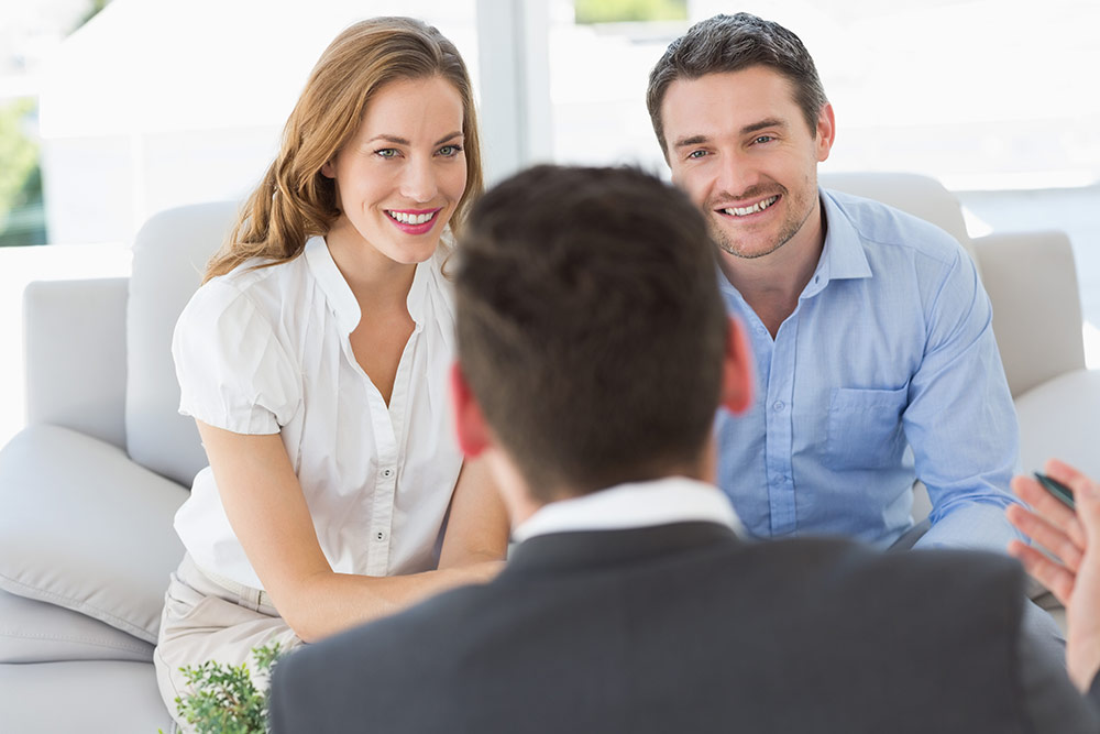 A keen couple finding out about Savill Knight's land option packages